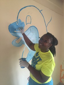 Jemella, quite the talented artist, painting her masterpiece dolphin.