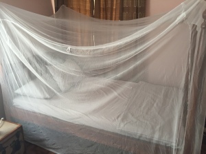 Sleeping under a mosquito net every night was part of my malaria prevention in Uganda.